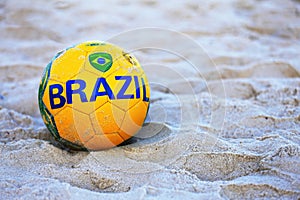 Football with the flag of Brazil at Copacabana Beach