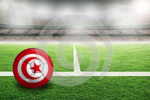 Football With Flag of Tunisia in Soccer Stadium With Copy Space