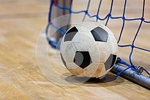 Football futsal ball goal and floor. Indoor soccer sports hall. Sport Futsal background. Indoor Soccer Winter League photo