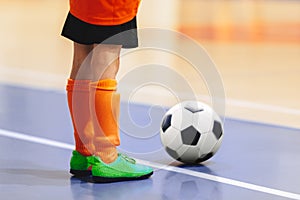 Football futsal player with ball. Futsal floor and players on training