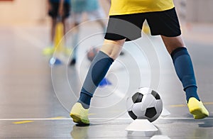 Football futsal player, ball, futsal floor. Sports background.