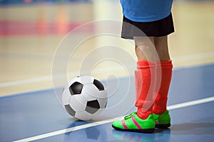 Football futsal training for children. Indoor soccer young player