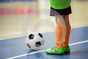 Football futsal training for children. Indoor soccer young player photo