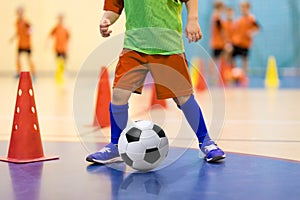 Football futsal training for children. Soccer training dribbling cone drill. Indoor soccer young player