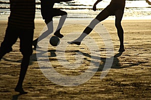 Football game on the beach