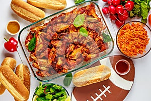 For football game parties wings come with dip sauce and salad.