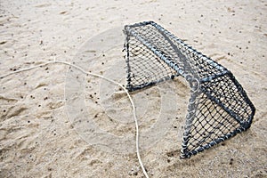 Football gate on sandy beach