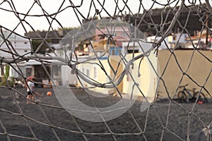 Football goal and children playing football in the