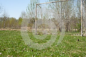 Football goal on a green field of grass