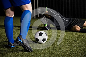 Football goalkeeper diving to stop a goal