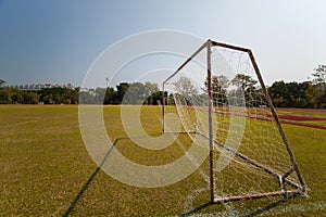 Football goals with green grass.