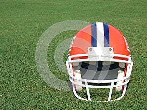 Football Helmet on Grass Field