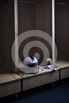 Football helmet sitting in an American Football Locker room and