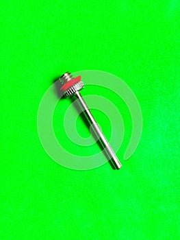 Football inflator isolated in green background