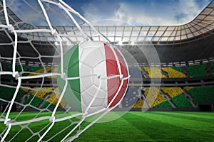 Football in italy colours at back of net