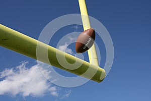 Football kicked through the uprights photo