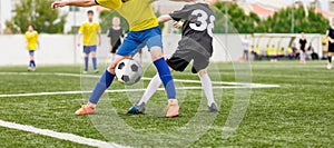 Football Kids Playing Game. Two Players in Opposing Teams in a Duel