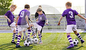 Football Kids Playing Game. Two Players in Opposing Teams in a Duel photo
