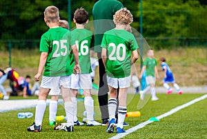 Football Match for Children. Youth Football Team With Coach. Boys As Reserve Players