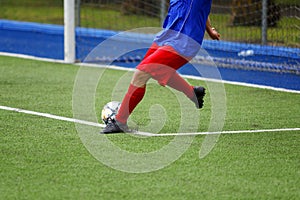 Football match, kick to the ball from a standstill