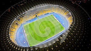 Football match on large stadium field, aerial view, sport championship on arena