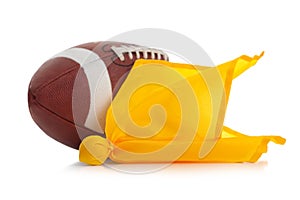 Football and penalty flag on white photo