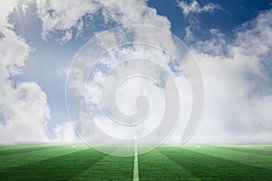 Football pitch under blue sky