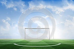 Football pitch under blue sky
