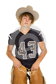 A football player in cowboy hat and chaps