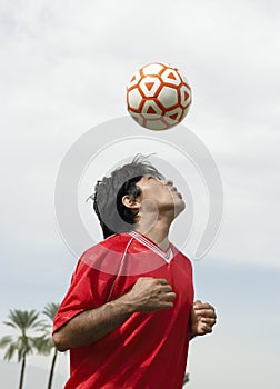 Football Player Heading The Ball photo