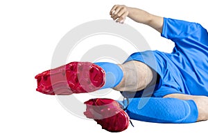 Football player man in a blue jersey with the pose of tackling the ball