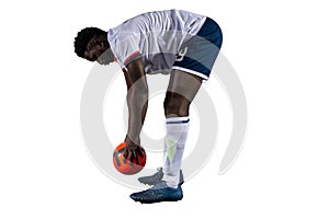 Football player plays with soccerball in a match