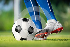 Football player set ball football on grass at freekick point before shoot or kick to win a score in international league football