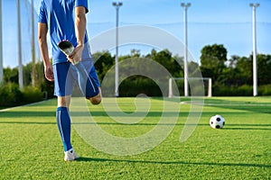 Football player set ball football on grass at freekick point before shoot or kick to win a score in international league football