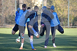 football players are doing stretching legs together october team dnepr dnepropetrovsk ÃÂity held an open training session at their