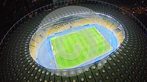 Football players on large stadium field, match, sports, aerial