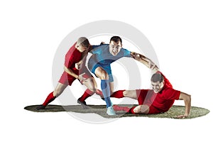 Football players tackling for the ball over white background