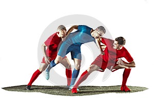 Football players tackling for the ball over white background