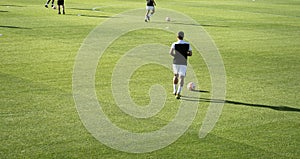 football players warming up before a football match