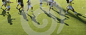 football players warming up before a football match