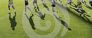 football players warming up before a football match