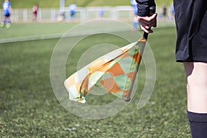 A football referee follows the game on the football field