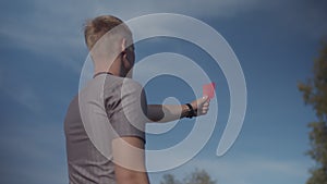 Football referee sending-off player after foul