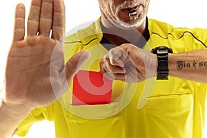 Football referee showing a red card to a displeased player isolated on white background