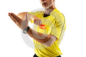 Football referee showing a red card to a displeased player isolated on white background