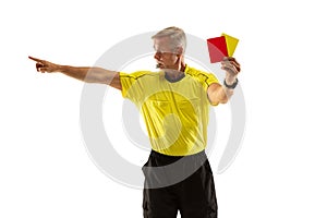 Football referee showing a red card to a displeased player isolated on white background