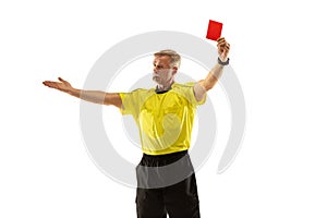 Football referee showing a red card to a displeased player isolated on white background