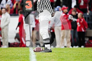 Football resting on the Yardline