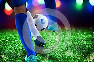 Football scene with competing soccer players at the stadium