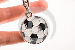 Football shaped keyholder in hand